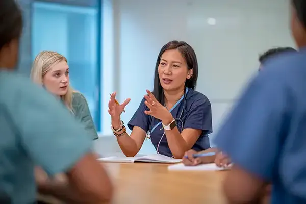 Revenue team collaborating at conference table