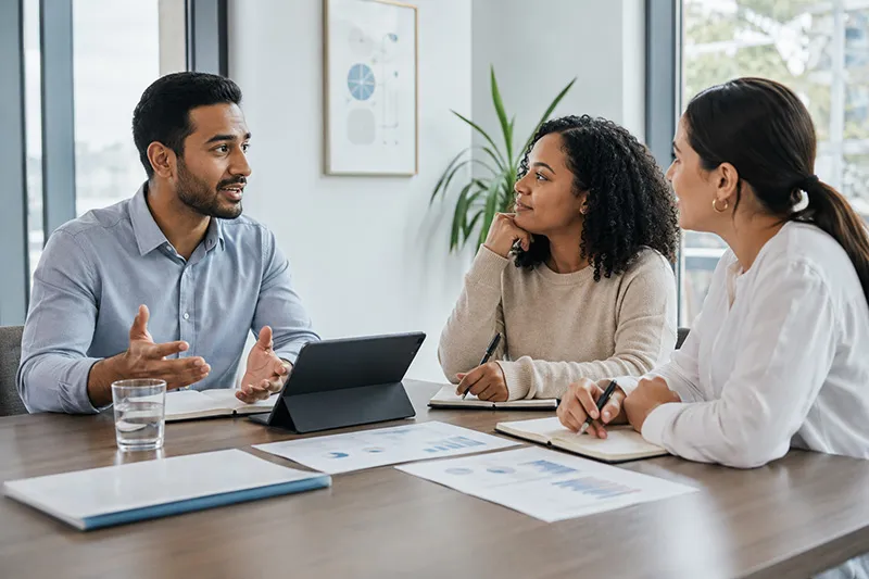 Revenue team collaborating at conference table